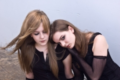 Teen girls huddling together