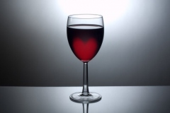Glass of wine with heart shaped glow