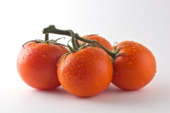 Red ripe tomatoes against white